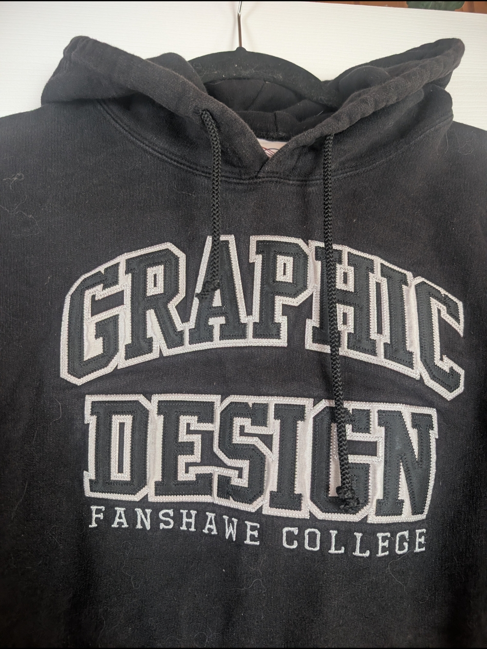 Classic Black Hoodie with Gray Graphic Design Fanshawe College Logo
